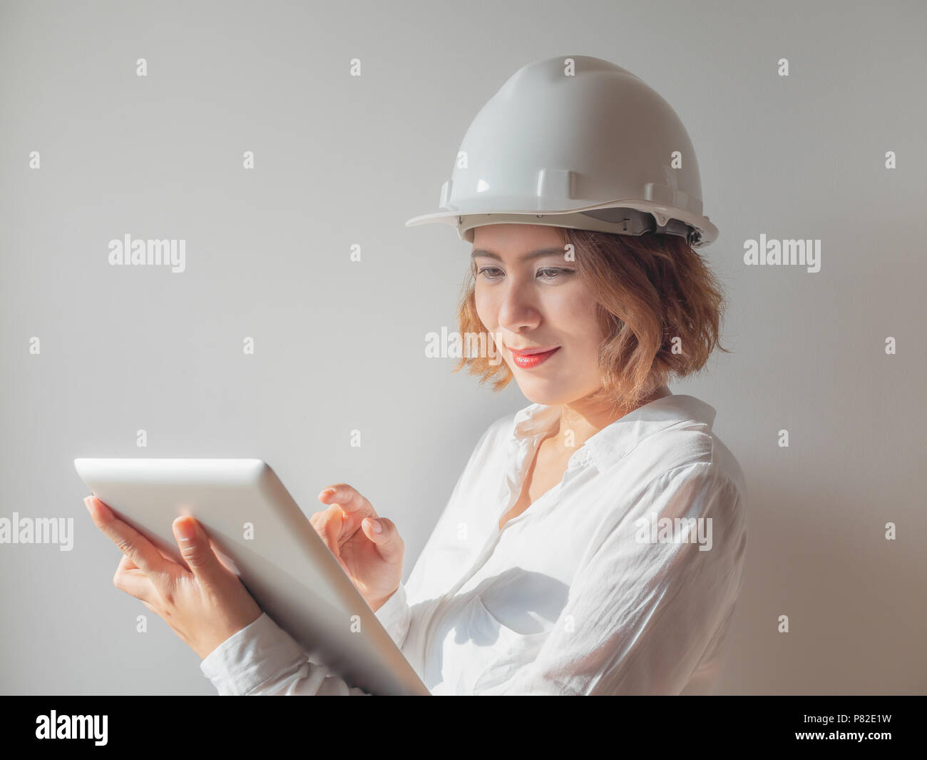 Beautiful Asian Woman Engineer Curly Short Hair Wearing White