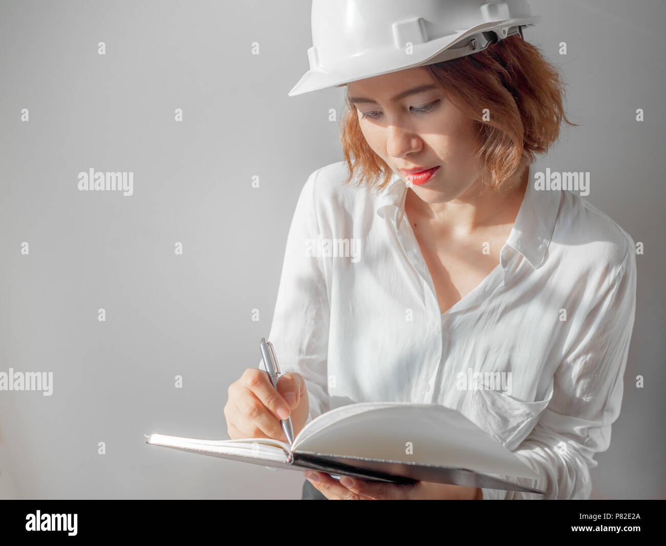 Beautiful Asian Woman Engineer Curly Short Hair Wearing White