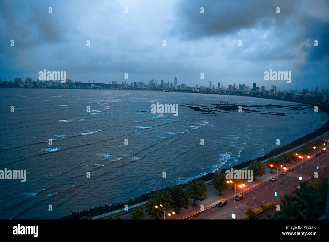 Top view of Marine Drive - queen's necklace, Nariman Point, Mumbai - Bombay, India on cloudy evening showing skyline of city and arabian sea Stock Photo