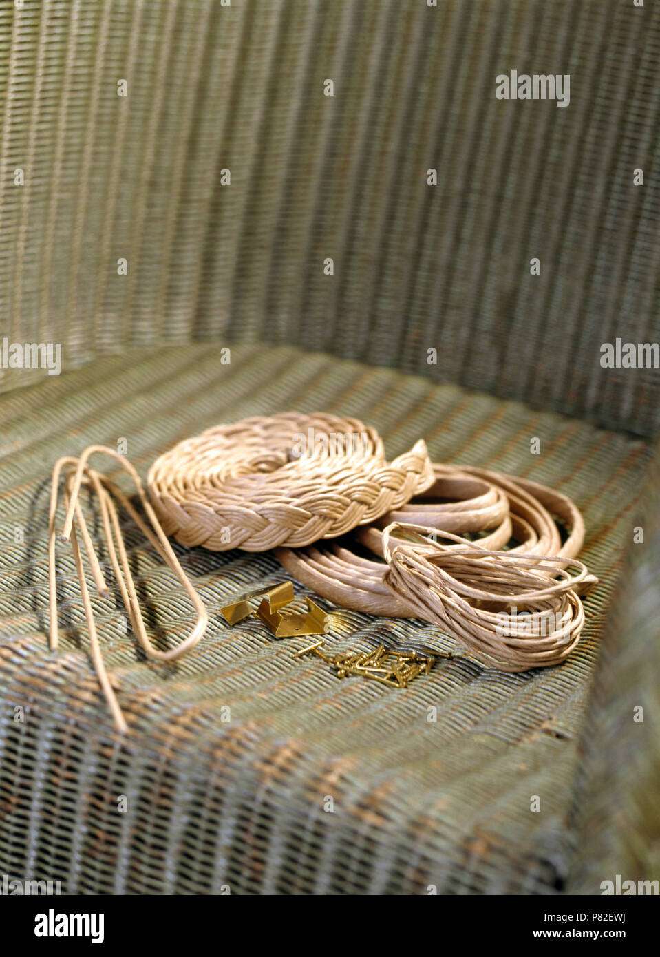 Close-up of renovation materials on seat of a damaged Lloyd Loom chair  Stock Photo - Alamy