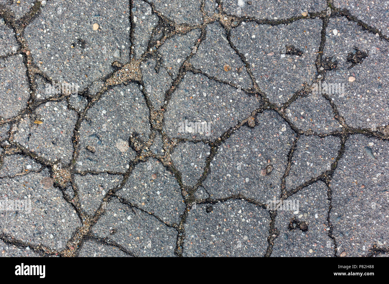 cracks on the asphalt pattern texture background Stock Photo