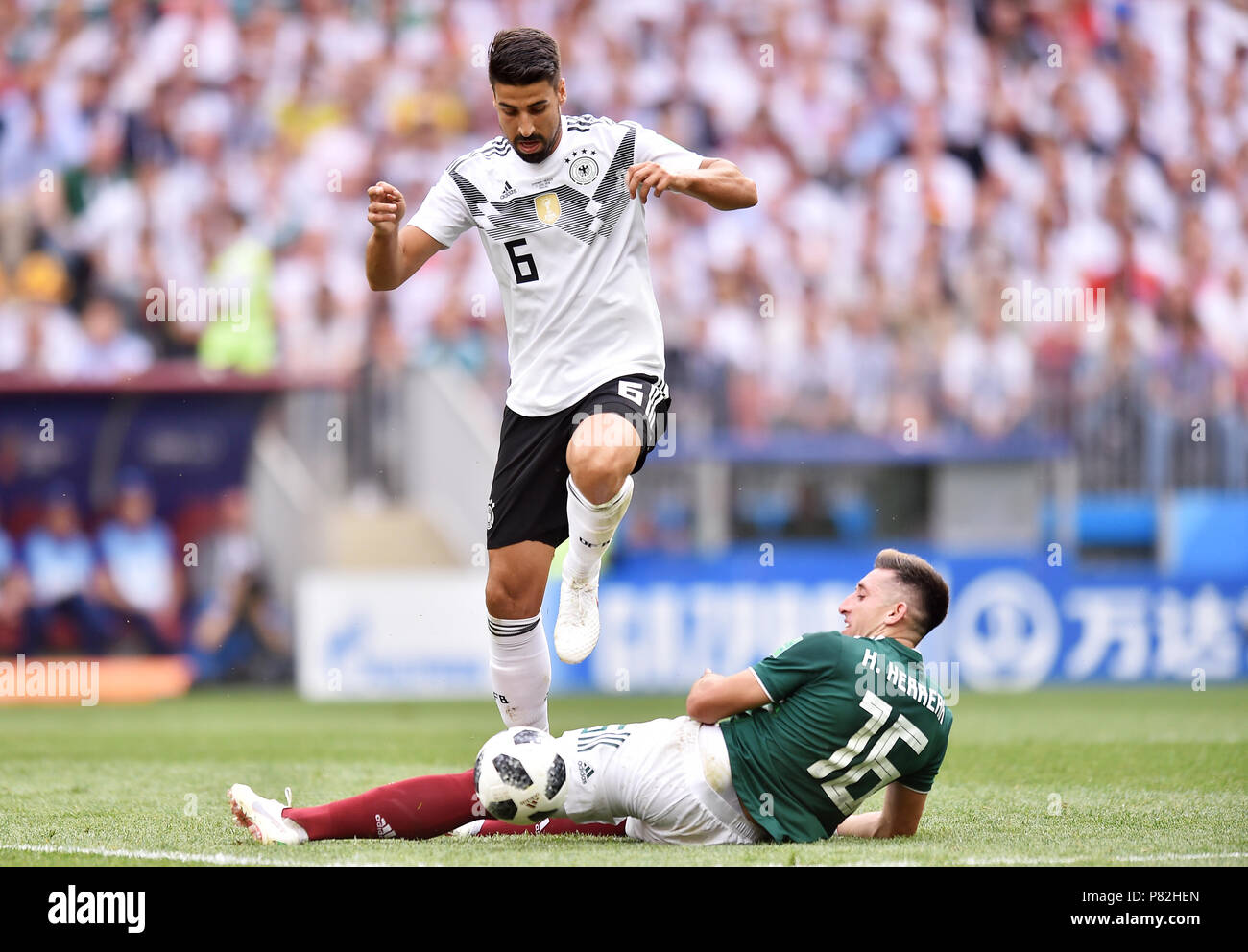 MOSCOW, RUSSIA - JUNE 17: Sami Khedira of Germany competes with Hector Herrera of Mexico during the 2018 FIFA World Cup Russia group F match between Germany and Mexico at Luzhniki Stadium on June 17, 2018 in Moscow, Russia. (Photo by Lukasz Laskowski/PressFocus/MB Media) Stock Photo