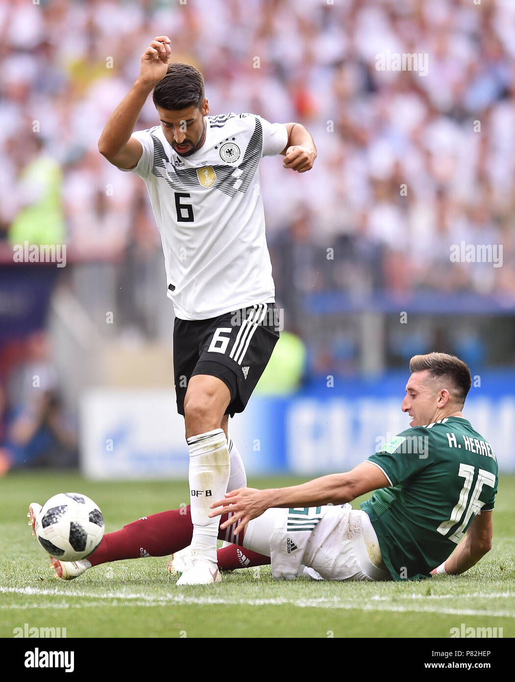 MOSCOW, RUSSIA - JUNE 17: Sami Khedira of Germany competes with Hector Herrera of Mexico during the 2018 FIFA World Cup Russia group F match between Germany and Mexico at Luzhniki Stadium on June 17, 2018 in Moscow, Russia. (Photo by Lukasz Laskowski/PressFocus/MB Media) Stock Photo