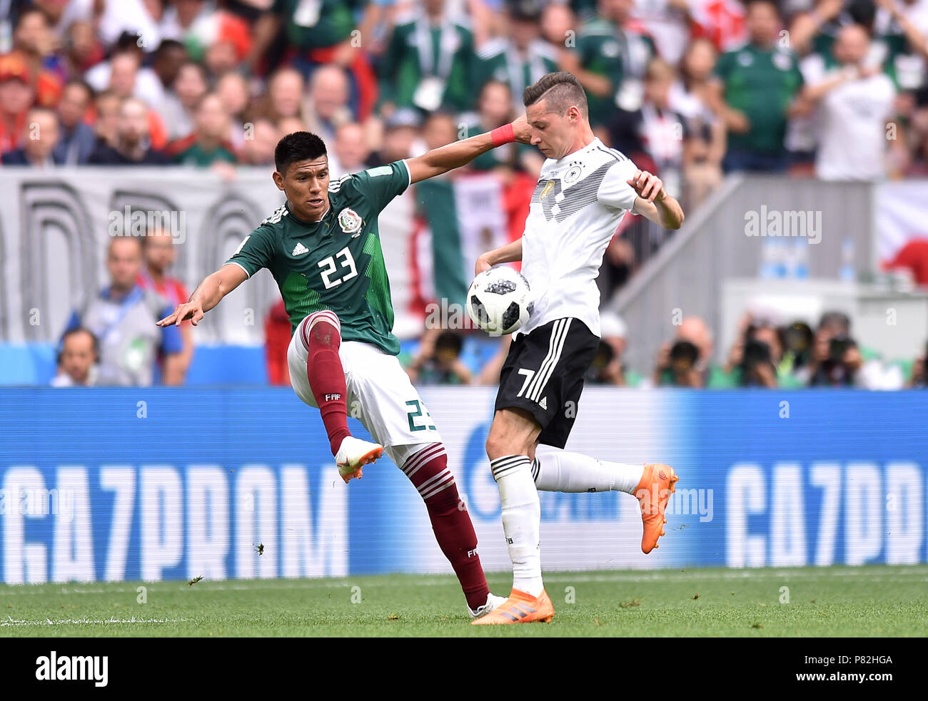 MOSCOW, RUSSIA - JUNE 17: Jesus Gallardo of Mexico competes with Julian Draxler of Germany during the 2018 FIFA World Cup Russia group F match between Germany and Mexico at Luzhniki Stadium on June 17, 2018 in Moscow, Russia. (Photo by Lukasz Laskowski/PressFocus/MB Media) Stock Photo