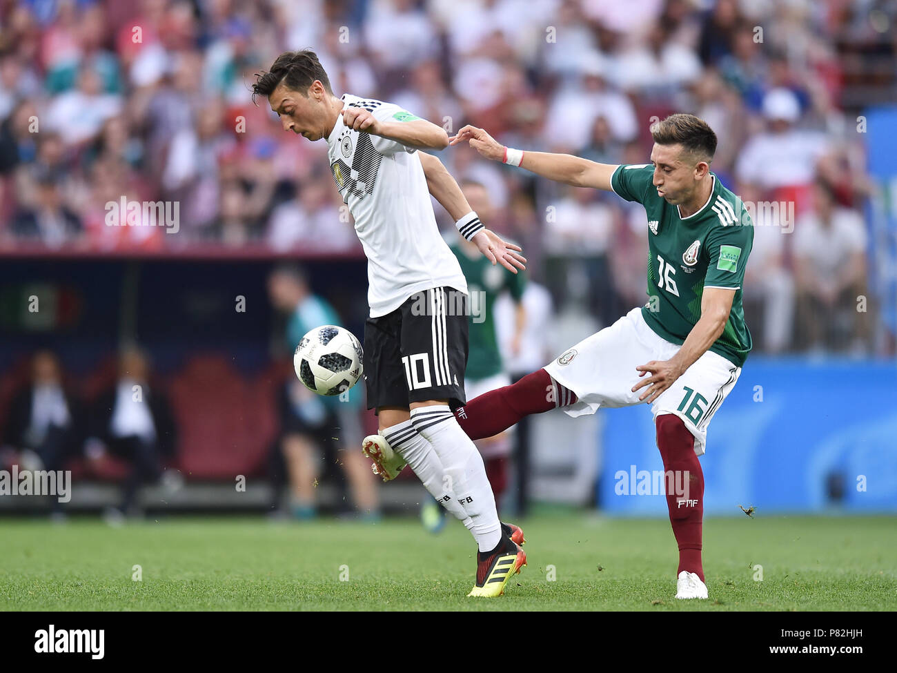 MOSCOW, RUSSIA - JUNE 17: Hector Herrera of Mexico competes with Mesut Oezil of Germany during the 2018 FIFA World Cup Russia group F match between Germany and Mexico at Luzhniki Stadium on June 17, 2018 in Moscow, Russia. (Photo by Lukasz Laskowski/PressFocus/MB Media) Stock Photo