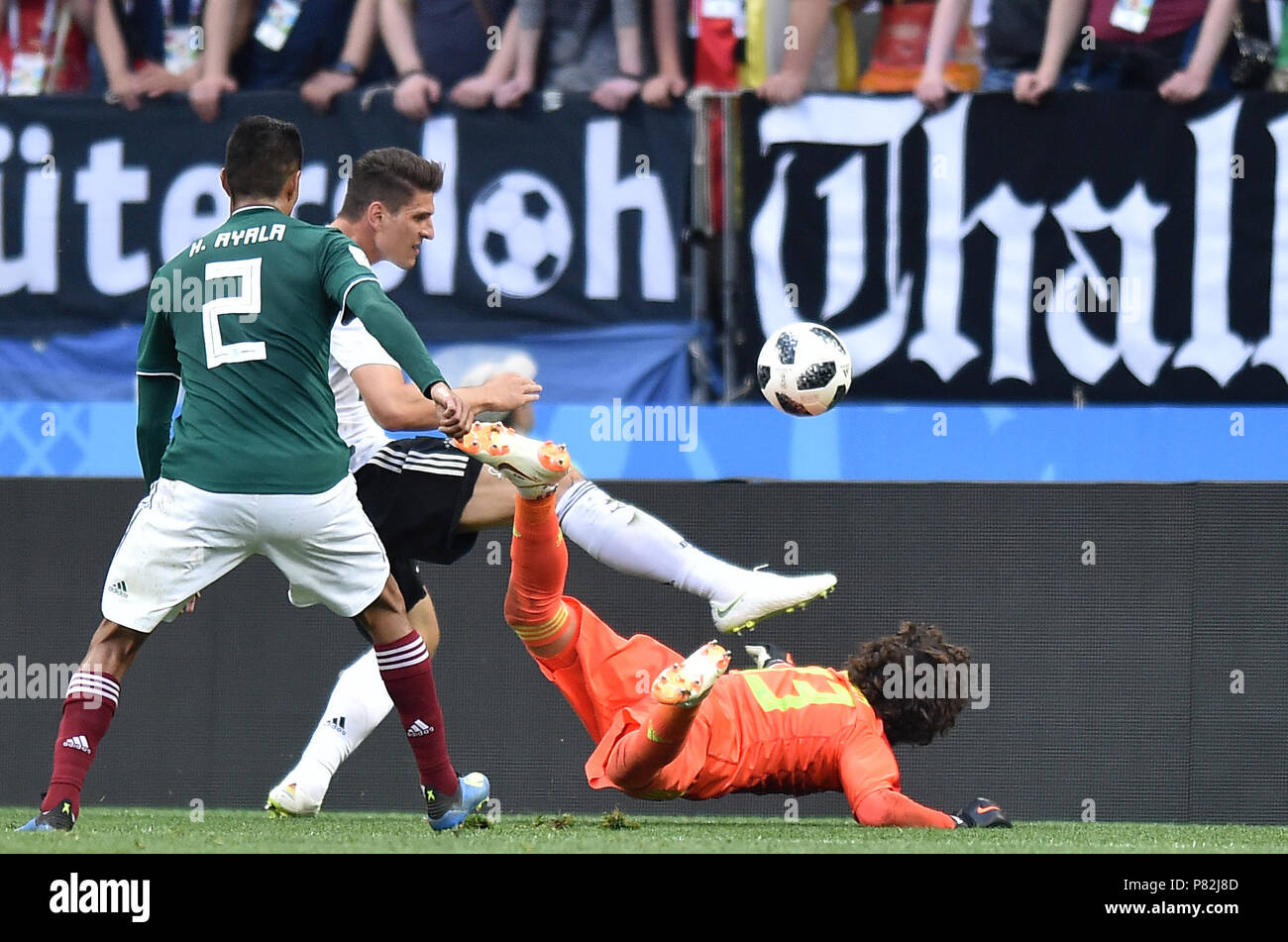 MOSCOW, RUSSIA - JUNE 17: Mario Gomez of Germany competes with Guillermo Ochoa of Mexico during the 2018 FIFA World Cup Russia group F match between Germany and Mexico at Luzhniki Stadium on June 17, 2018 in Moscow, Russia. (Photo by Lukasz Laskowski/PressFocus/MB Media) Stock Photo