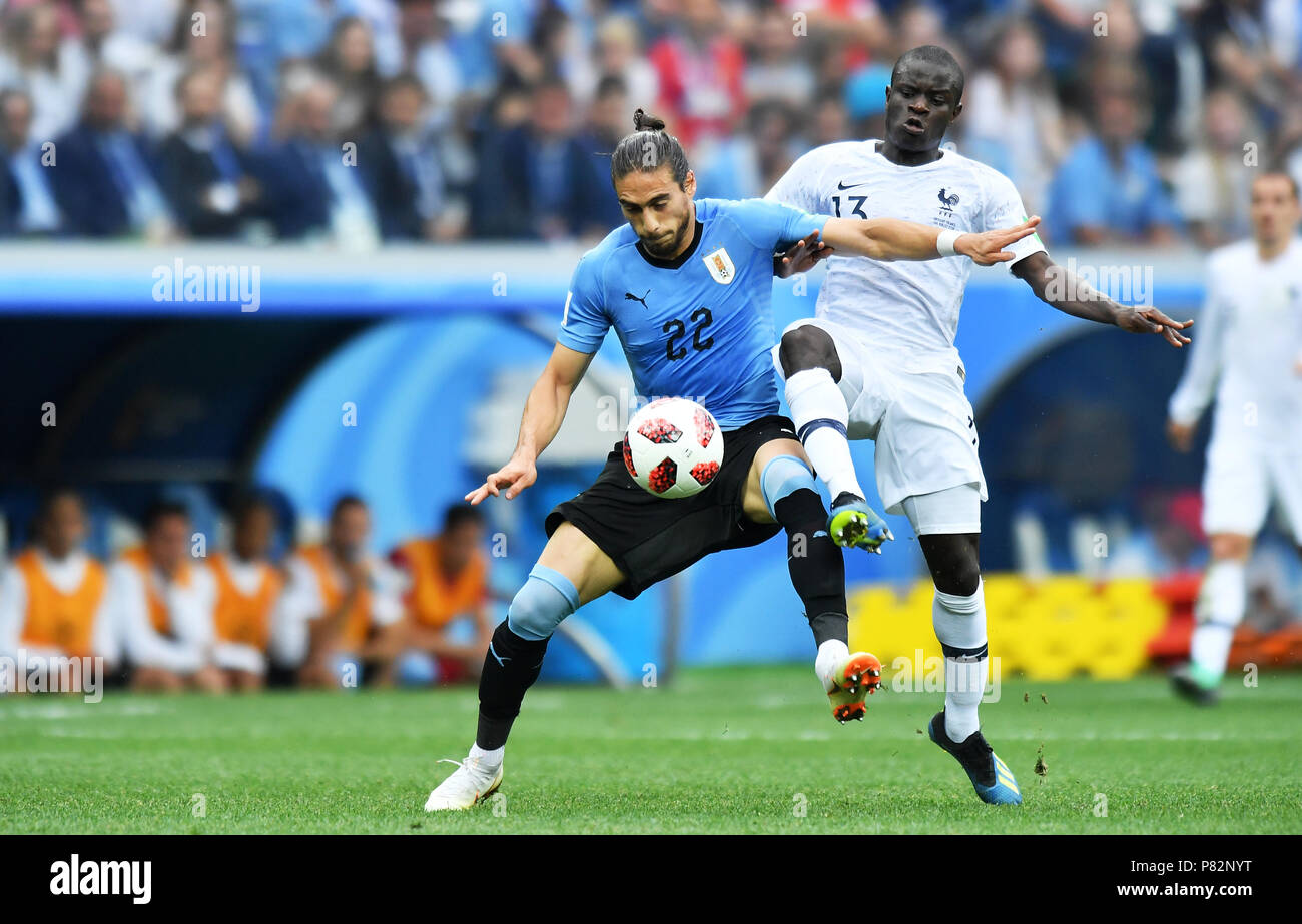 NIZHNY NOVGOROD, RUSSIA - JULY 06: Martin Caceres of Uruguay competes with Ngolo Kante of France during the 2018 FIFA World Cup Russia Quarter Final match between Uruguay and France at Nizhny Novgorod Stadium on July 6, 2018 in Nizhny Novgorod, Russia. (Photo by Lukasz Laskowski/PressFocus/MB Media) Stock Photo