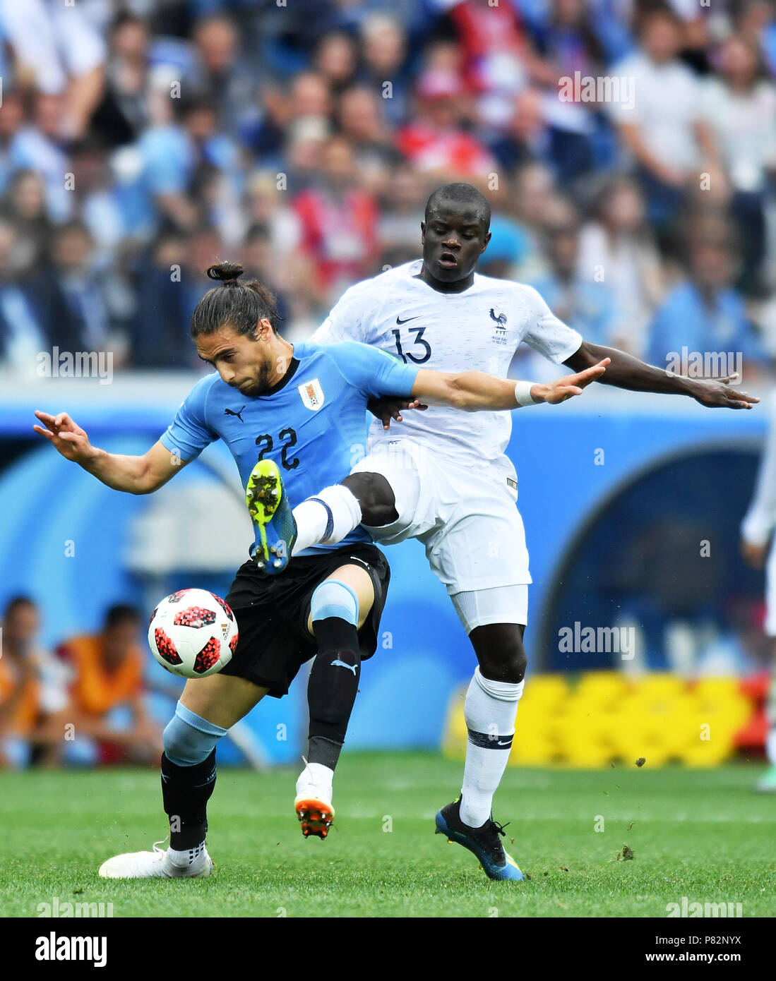 NIZHNY NOVGOROD, RUSSIA - JULY 06: Martin Caceres of Uruguay competes with Ngolo Kante of France during the 2018 FIFA World Cup Russia Quarter Final match between Uruguay and France at Nizhny Novgorod Stadium on July 6, 2018 in Nizhny Novgorod, Russia. (Photo by Lukasz Laskowski/PressFocus/MB Media) Stock Photo