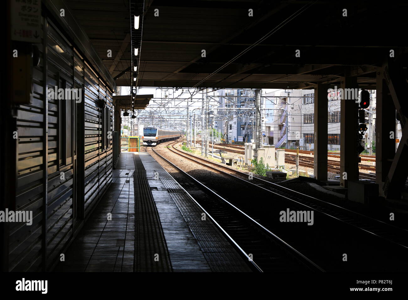 Train coming when people waiting for transportation, TACHiKAWA  Japan Stock Photo