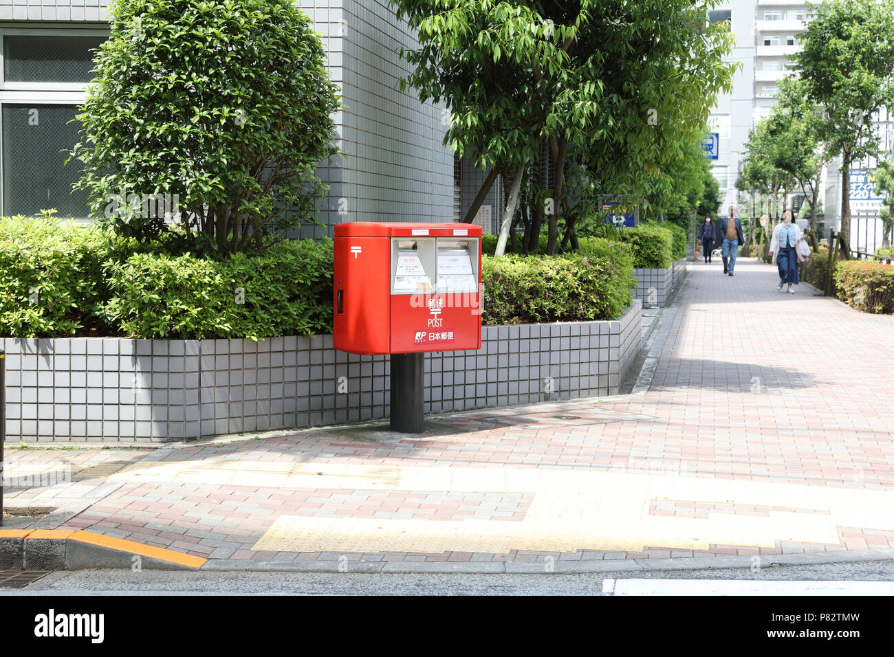 TOKYO, Japan - May 2018 : Red Japanese postbox on way side at Lidabashi Tokyo. Stock Photo