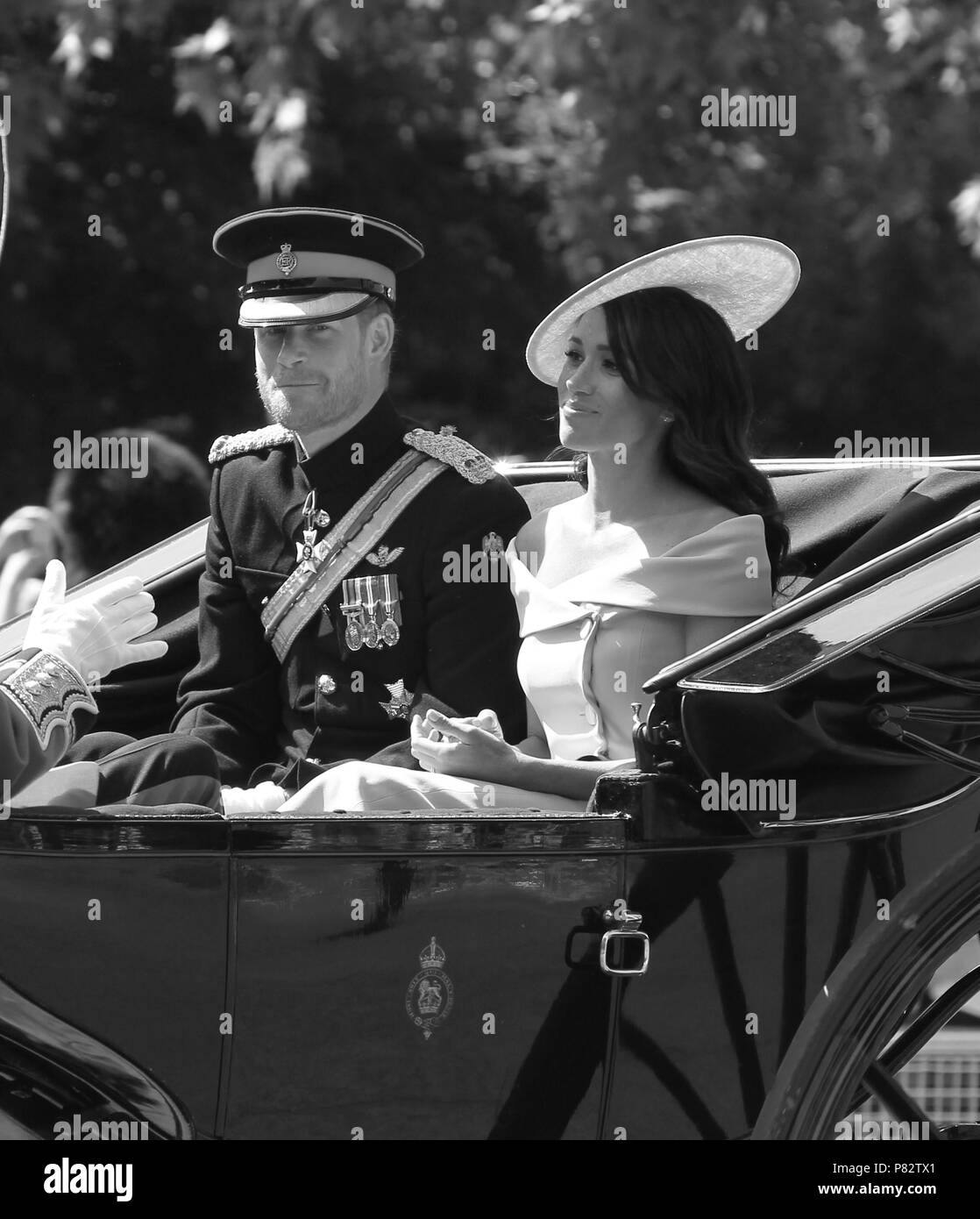 LONDON - JUN 09, 2018:  ( Image digitally altered to monochrome ) Prince Harry, Duke of Sussex and Meghan, Duchess of Sussex at the Trooping The Colour 2018 on the Mall Stock Photo