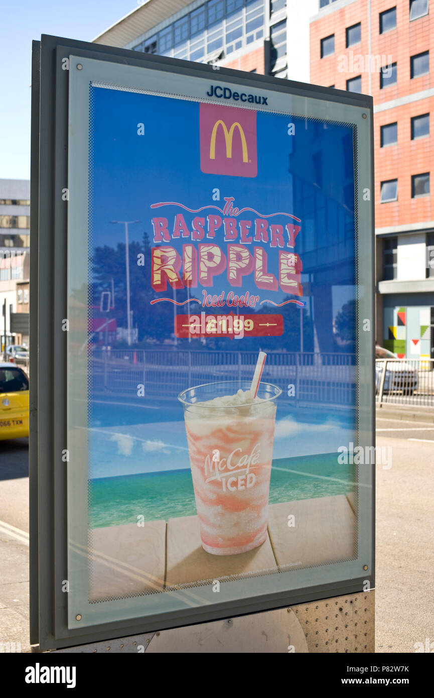 JCDecaux roadside billboard site advertising McDonalds raspberry ripple iced cooler in Plymouth Devon England UK Stock Photo