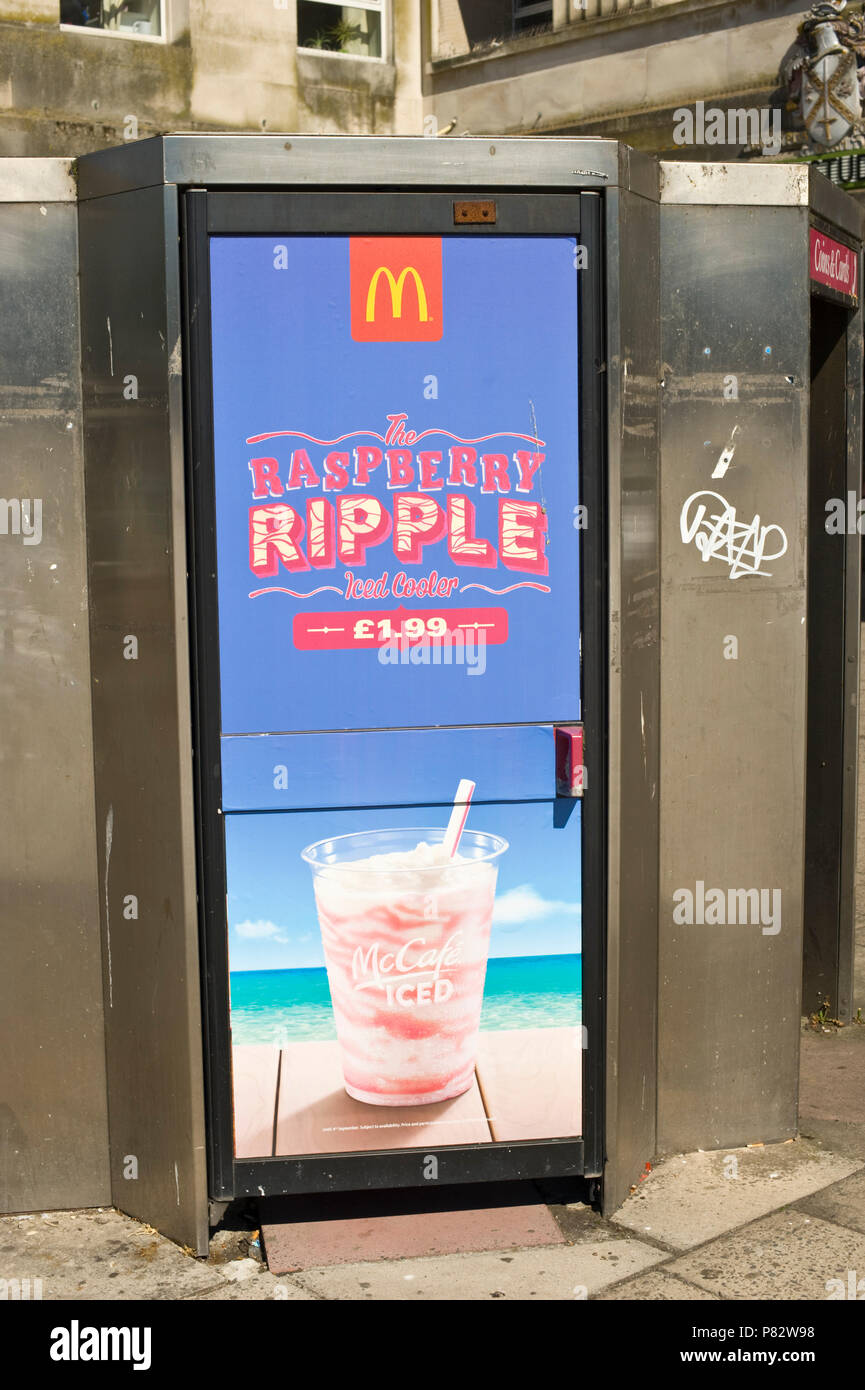 Phonebox billboard site advertising McDonalds raspberry ripple iced cooler in Plymouth Devon England UK Stock Photo