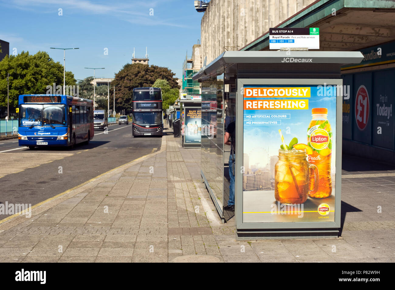 JCDecaux roadside bus stop billboard site advertising Lipton iced tea in Plymouth Devon England UK Stock Photo