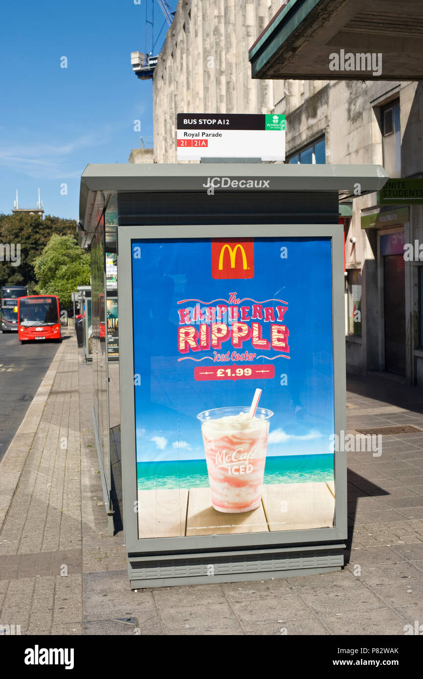 JCDecaux roadside bus stop billboard site advertising McDonalds raspberry ripple iced cooler in Plymouth Devon England UK Stock Photo