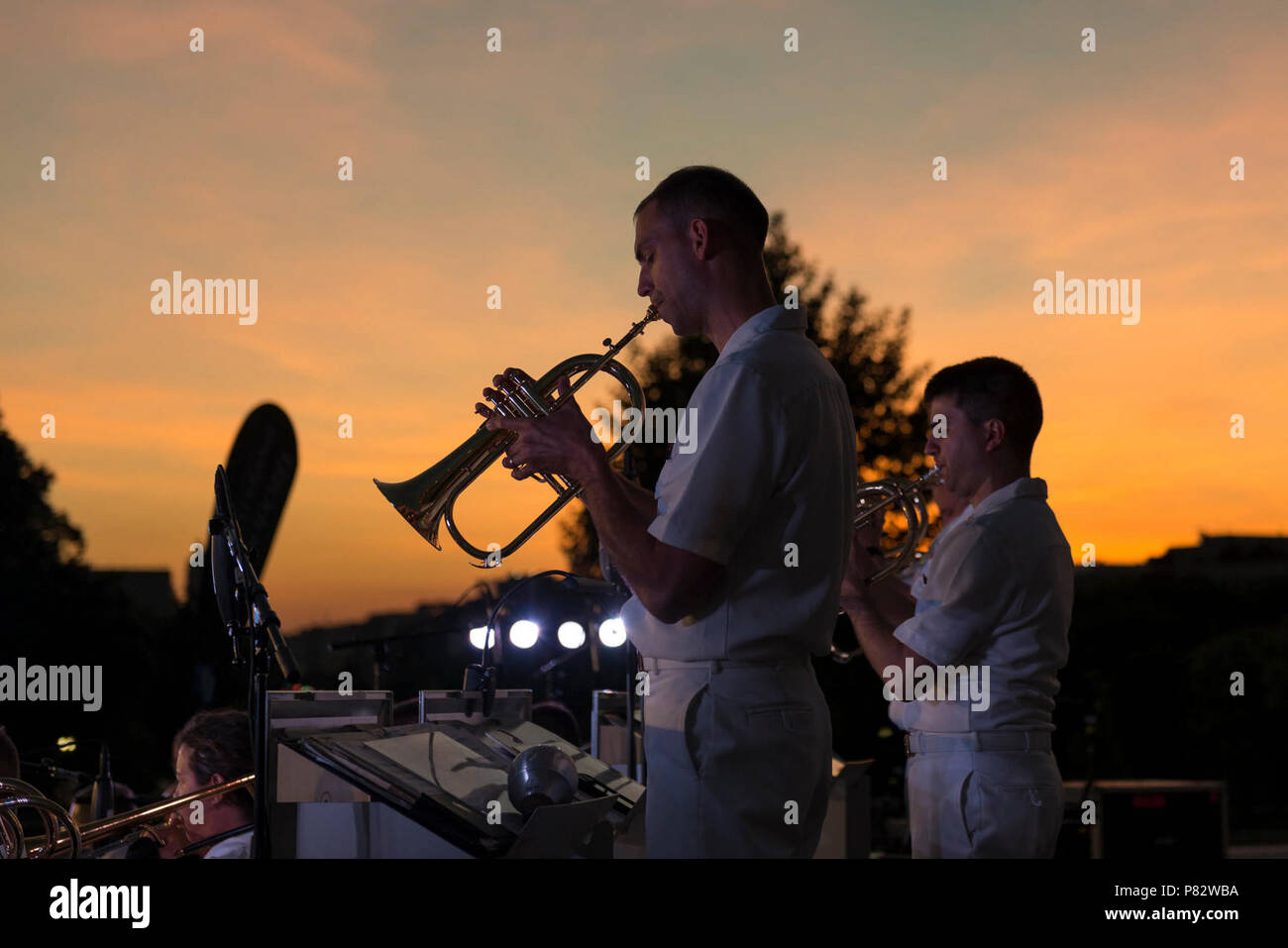 WASHINGTON (July 11, 2016) (Left to right) Musician 1st Class Jonathan Barnes, of Dundalk, Md., and Musician 1st Class Tyler Mire, of Nashville, Tenn., play flugelhorn with the United States Navy Band Commodores jazz ensemble. The Navy Band presents concerts at the Capitol on Monday evenings throughout the summer. Stock Photo