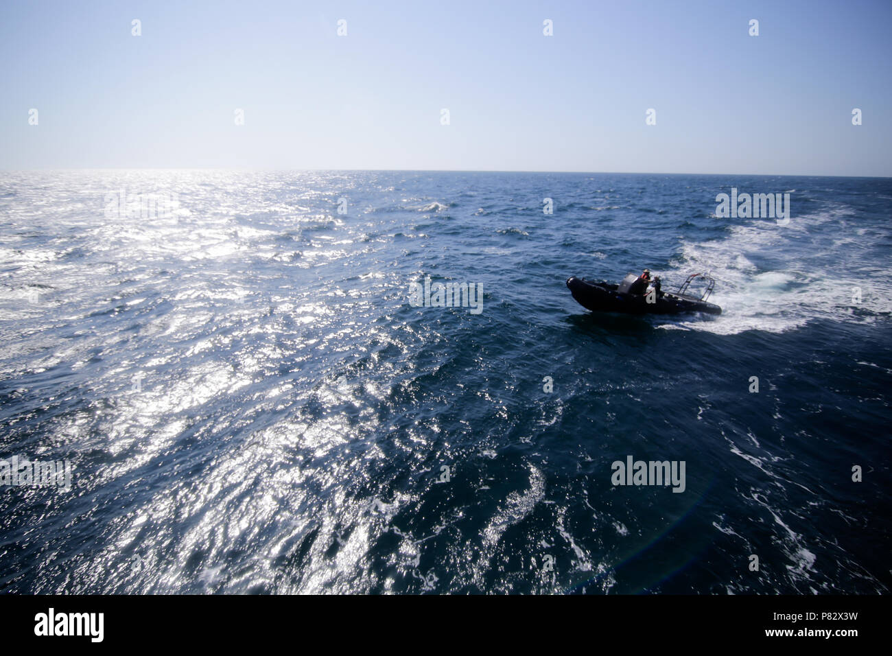 CONSTANTA, ROMANIA - JUNE 24, 2018 - Military rubber boat speeding on water near the city of Constanta, on June 24, 2018. Stock Photo