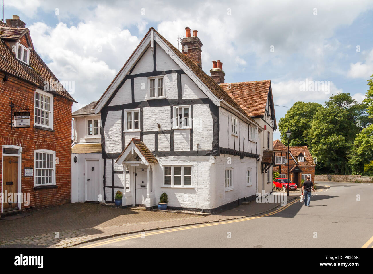 Princes Risborough, England-3rd June 2018: A man walks past a grade II listed building. There are many listed buildings in the town. Stock Photo