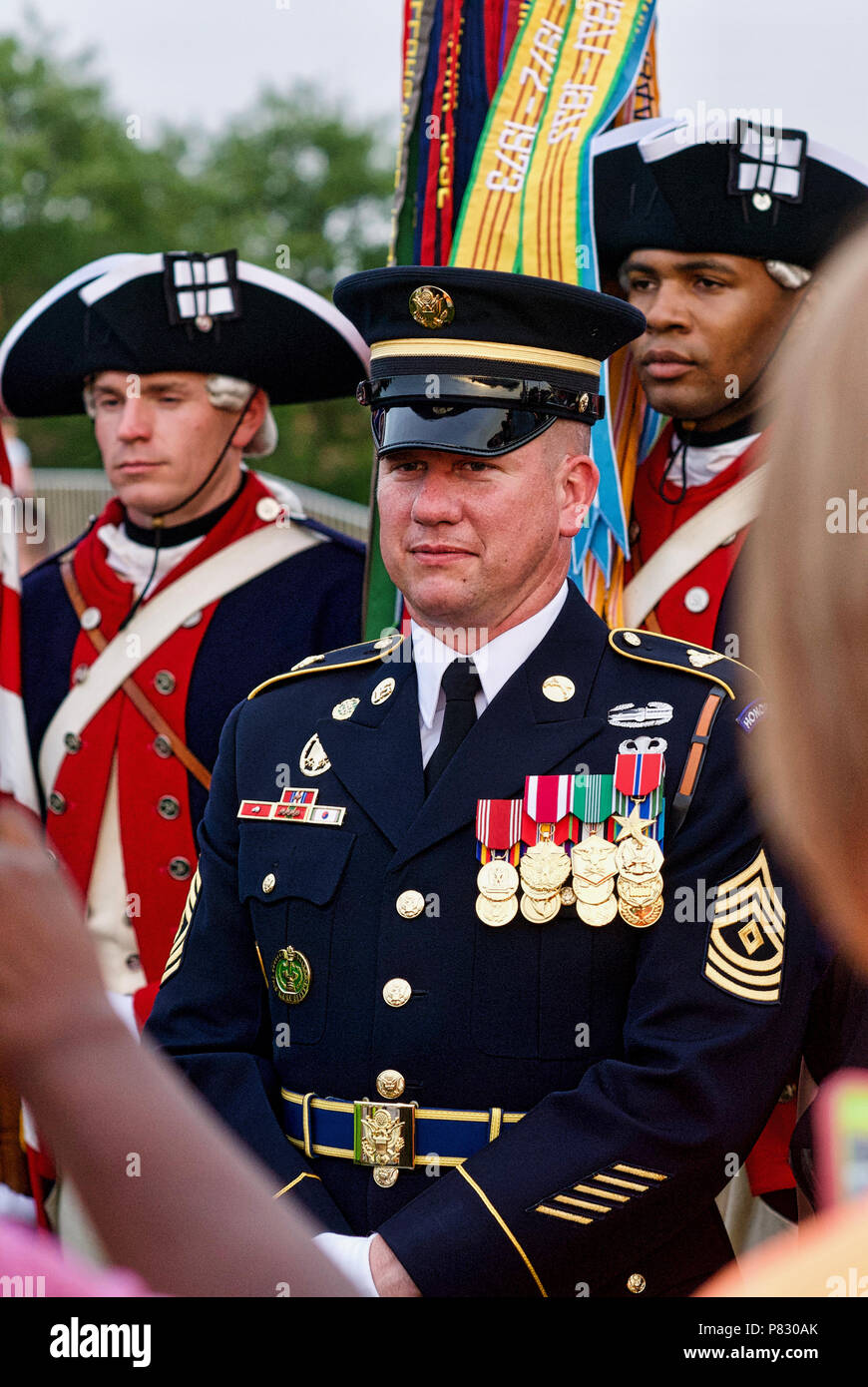 Fort Myer, Virginia - June 13, 2018: A First Sergeant of the Old Guard poses for photos in front of member of the U.S. Army Continental Color Guard. Stock Photo