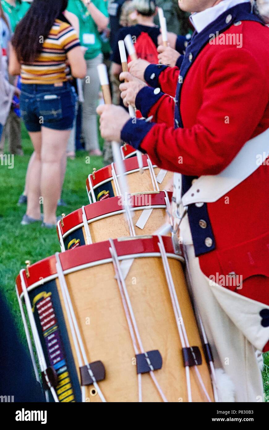 Fort Myer, Virginia, USA - June 13, 2018: Drummers of the U.S. Army Old Guard Fife and Drum Corps perform for visitors following a Twilight Tattoo. Stock Photo