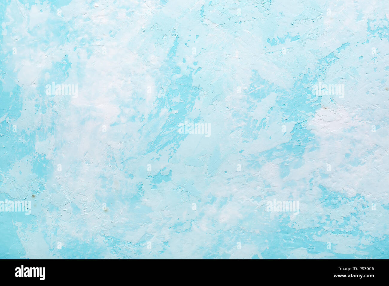 Light Blue abstract textured plaster background, surface of old turquoise colored wall. Stock Photo