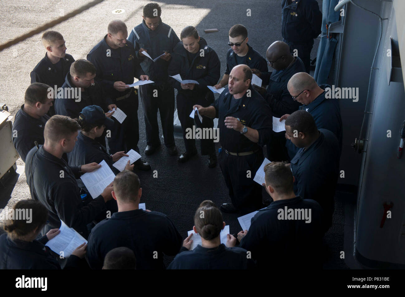 PACIFIC OCEAN (Oct. 3, 2016) Lt. Josh Sherwin, a Navy chaplain, leads a Rosh Hashanah ceremony on USS John C. Stennis' (CVN 74) fantail. Rosh Hashanah is a two-day celebration of the Jewish New Year and provides the opportunity to reflect on the past year and look ahead in the New Year. Sherwin, one of ten rabbis in the Navy, visited John C. Stennis at sea to provide religious services for the crew during the High Holy Days. John C. Stennis is underway conducting proficiency and sustainment training. Stock Photo