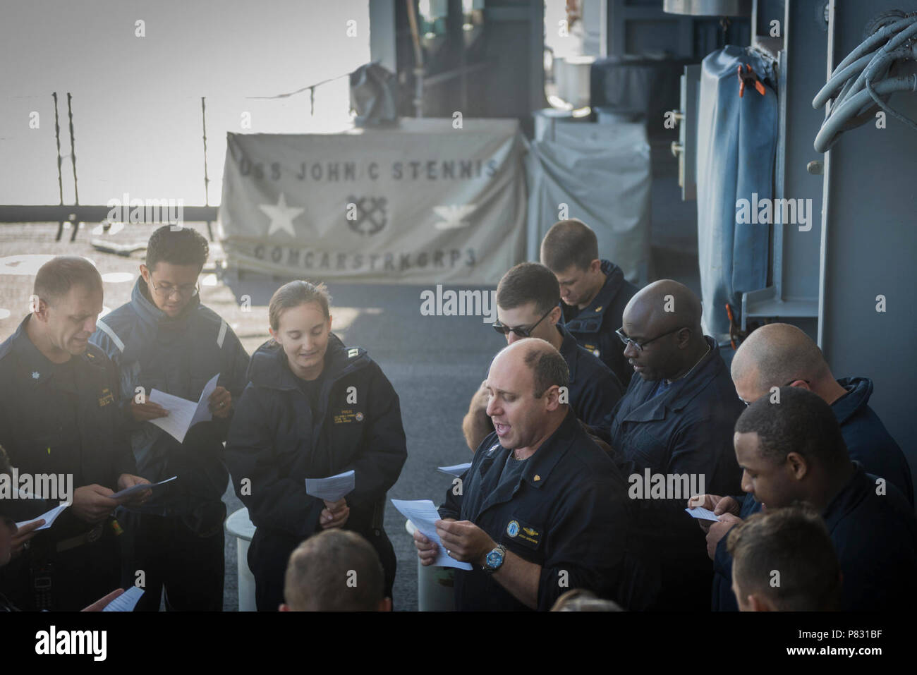 PACIFIC OCEAN (Oct. 3, 2016) Lt. Josh Sherwin, a Navy chaplain, leads a Rosh Hashanah ceremony on USS John C. Stennis' (CVN 74) fantail. Rosh Hashanah is a two-day celebration of the Jewish New Year and provides the opportunity to reflect on the past year and look ahead in the New Year. Sherwin, one of ten rabbis in the Navy, visited John C. Stennis at sea to provide religious services for the crew during the High Holy Days. John C. Stennis is underway conducting proficiency and sustainment training. Stock Photo