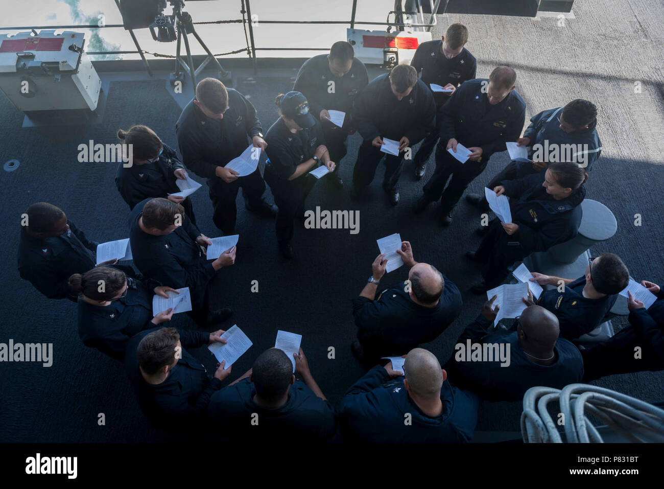 PACIFIC OCEAN (Oct. 3, 2016) Lt. Josh Sherwin, a Navy chaplain, leads a Rosh Hashanah ceremony on USS John C. Stennis' (CVN 74) fantail. Rosh Hashanah is a two-day celebration of the Jewish New Year, an opportunity to reflect on the past year and look ahead in the New Year. Sherwin, one of ten rabbis in the Navy, visited John C. Stennis at sea to provide religious services for the crew during the High Holy Days. John C. Stennis is underway conducting proficiency and sustainment training. Stock Photo