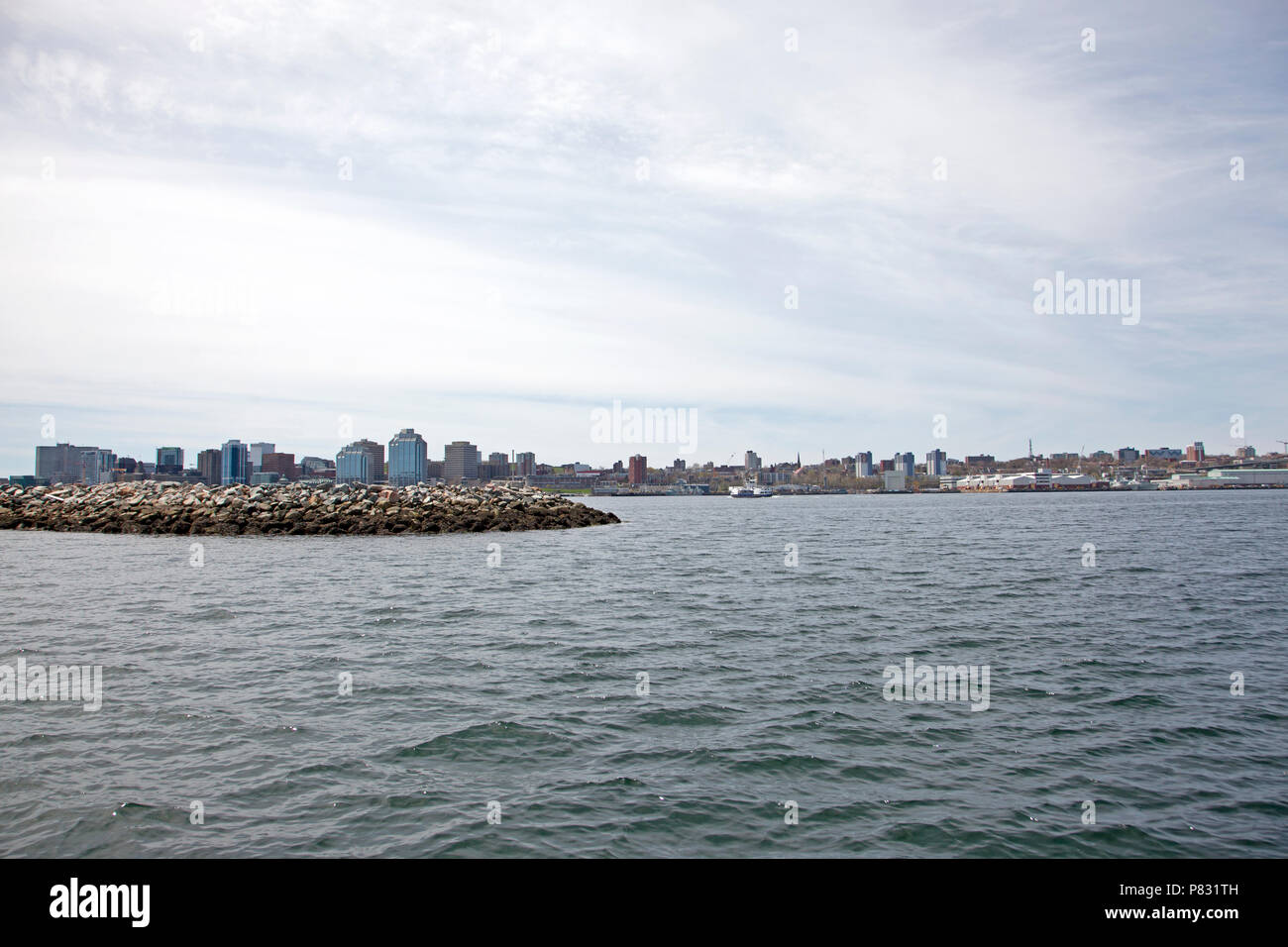 May 12, 2018 - Dartmouth, Nova Scotia: Over the Halifax Harbor from the Dartmouth side, Purdy's Wharf and naval shipyard viewable Stock Photo
