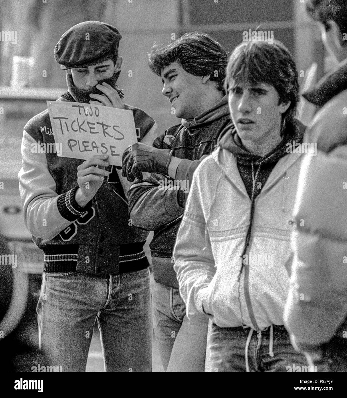 Stanford, California, USA. 20th Jan, 1985. Fan with sign wants a ticket at the Super Bowl XIX tailgate on the Stanford University campus. The San Francisco 49ers defeated the Miami Dolphins 38-16 on Sunday, January 20, 1985. Credit: Al Golub/ZUMA Wire/Alamy Live News Stock Photo