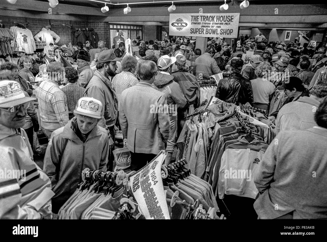 Stanford, California, USA. 20th Jan, 1985. Fans pick up NFL gear at souvenir store near the Super Bowl XIX tailgate on the Stanford University campus. The San Francisco 49ers defeated the Miami Dolphins 38-16 on Sunday, January 20, 1985. Credit: Al Golub/ZUMA Wire/Alamy Live News Stock Photo