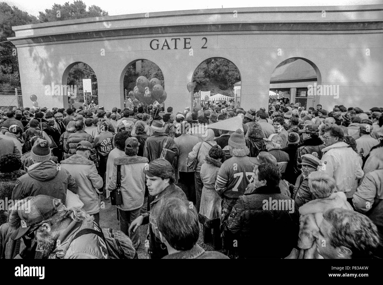 Stanford, California, USA. 20th Jan, 1985. Crowd files through gate 2 into the stadium after leaving the Super Bowl XIX tailgate on the Stanford University campus. The San Francisco 49ers defeated the Miami Dolphins 38-16 on Sunday, January 20, 1985. Credit: Al Golub/ZUMA Wire/Alamy Live News Stock Photo