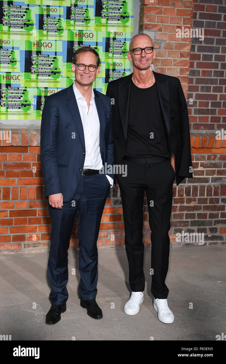 Berlin, Deutschland. 05th July, 2018. 05.07.2018, Berlin: Michael Muller  (l) and management of Hugo Boss Ingo Wilts come to the presentation of the  HUGO Mens and Womens' collection spring/summer 2019 in the