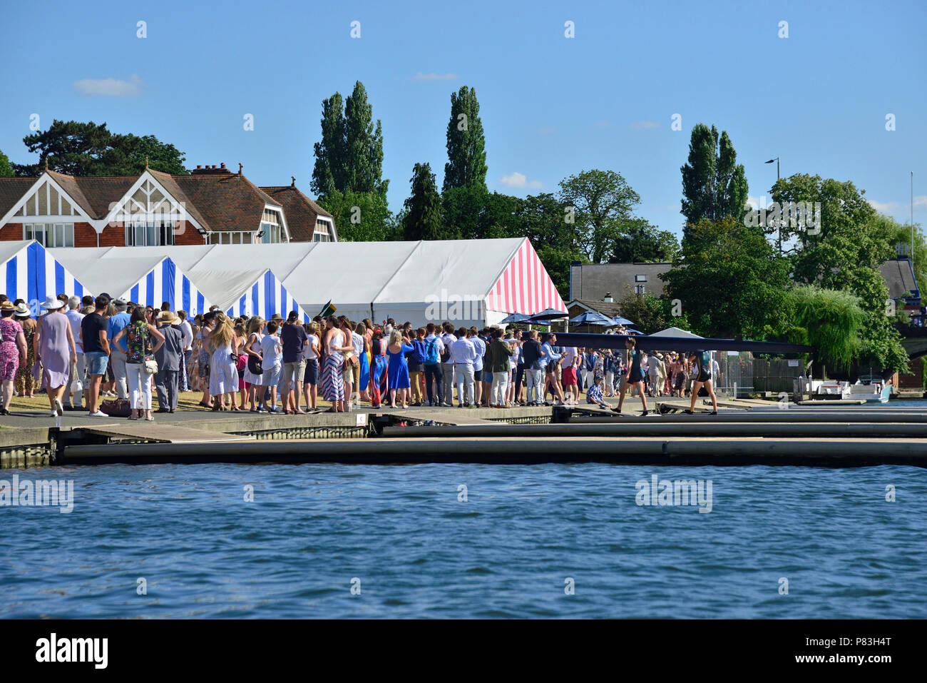 Following the finals of the Fawley Challenge Cup at Henley Royal Regatta friends and family welcome back the  The Windsor Boy's School winning crew where their time of 6.27 smashed the course record by seven seconds. Credit Wendy Johnson/Alamy Live News Stock Photo