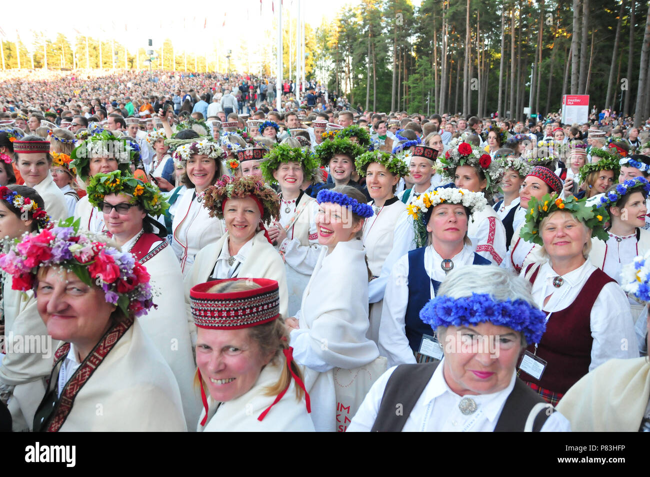 Riga, Latvia. 8th July, 2018. Singers in national costumes are seen before the closing concert of Latvia's XXVI Nationwide Song and XVI Dance Celebration in Riga, Latvia, on July 8, 2018. This concert concluded the week-long national song and dance celebration in which about 43,000 dancers and singers from Latvia and abroad participated. Credit: Janis/Xinhua/Alamy Live News Stock Photo