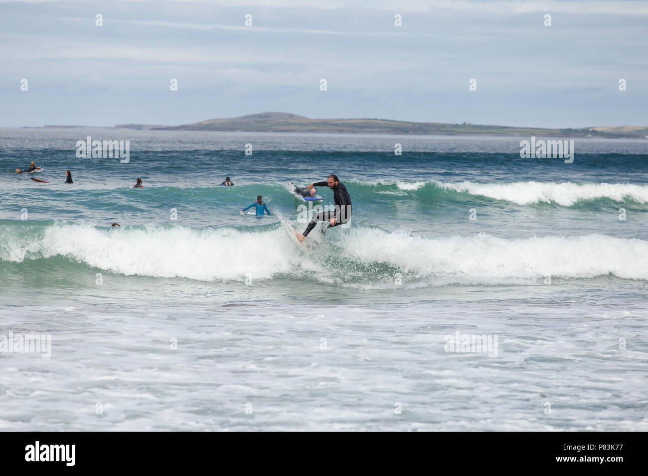 Strandhill, Sligo, Ireland. 8th July, 2018. Surfers enjoying the great weather and Atlantic waves surfing in Strandhill in county Sligo - one of the best places in Europe to surf. Credit: Michael Grubka/Alamy Live News Stock Photo