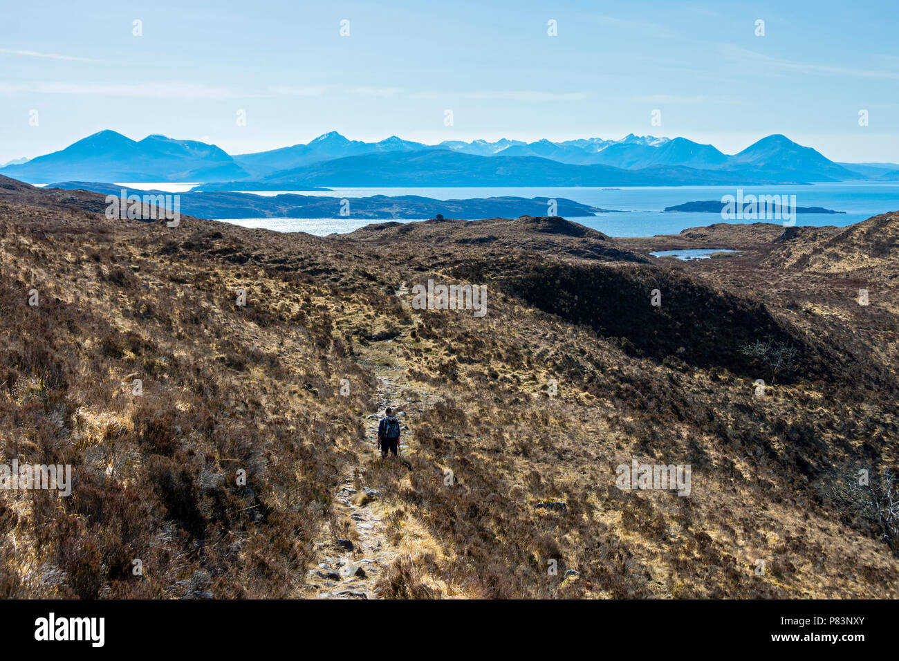 The Cuillin Hills of Skye from the track between Toscaig and Airigh-drishaig on the Applecross peninsula, Highland Region, Scotland, UK Stock Photo