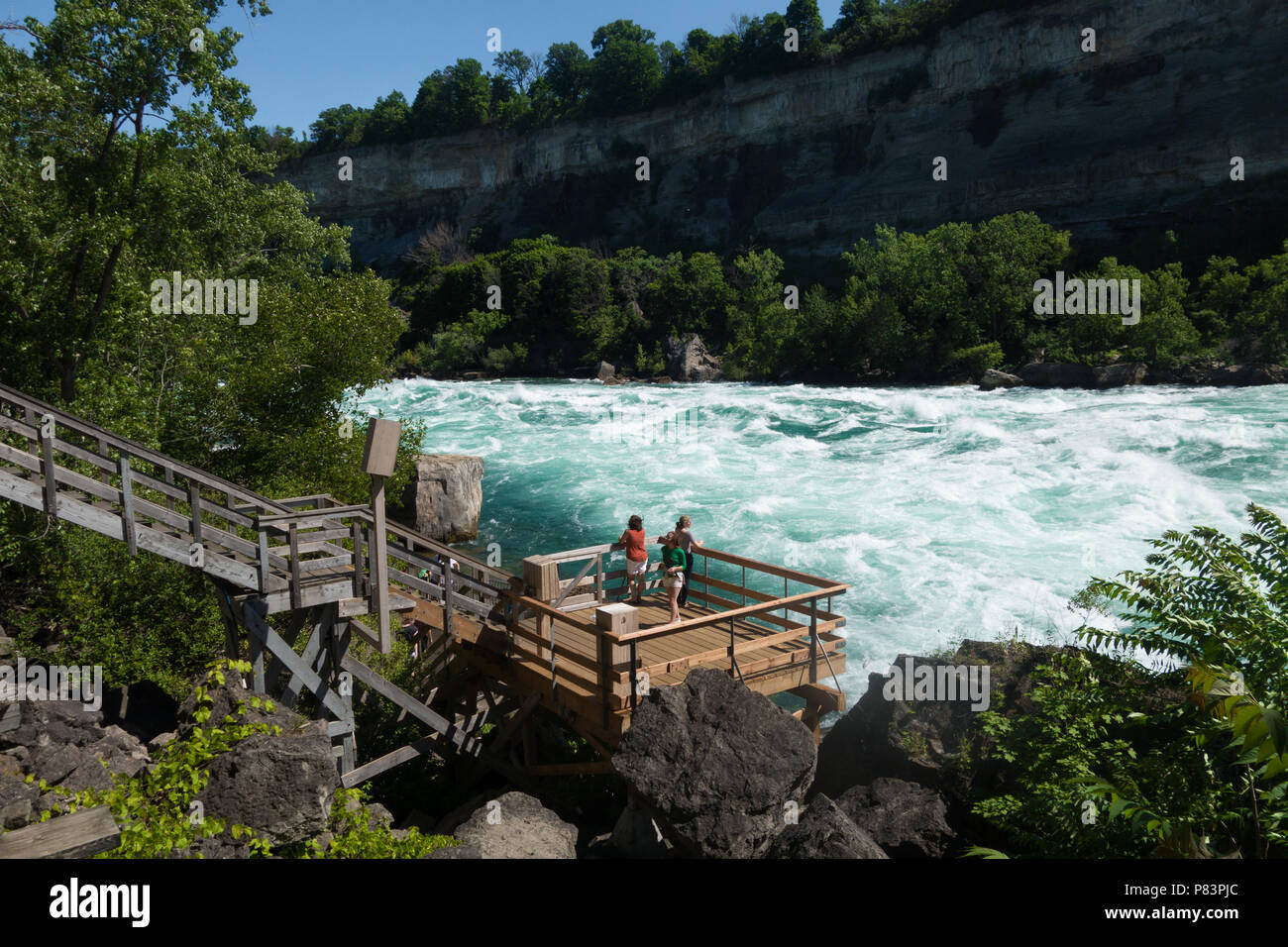the Niagara River’s Class 6 white-water rapids as seen from the White Water Walk attraction in the Niagara Gorge at Niagara Falls, Ontario, Canada Stock Photo
