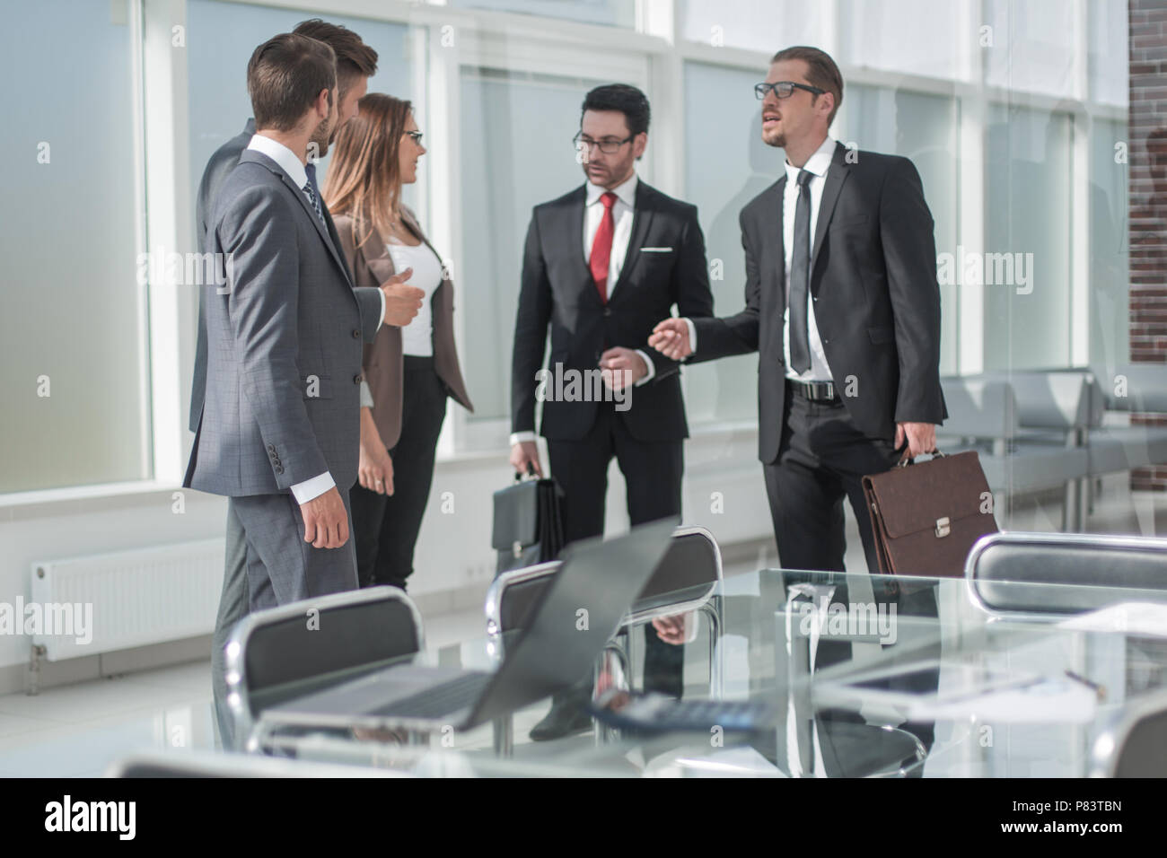 group of business people standing in the office Stock Photo - Alamy