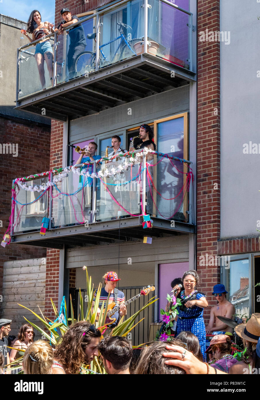 Jazz singer and band on two levels at a house in St Paul's Bristol performing to ecstatic and appreciative audience in the St Paul's Carnival Stock Photo