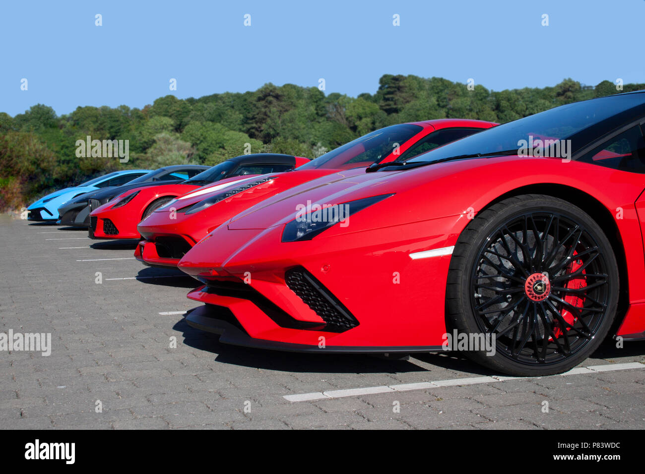 Supercars parked in the sun Stock Photo