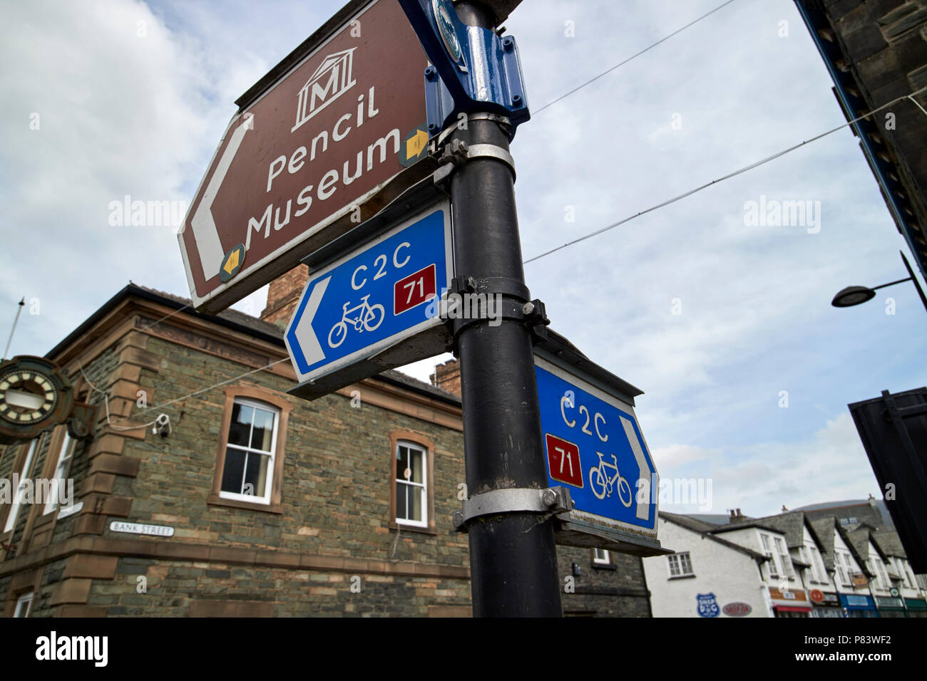 c2c coast to coast cycle route signs on main street keswick cumbria england uk Stock Photo