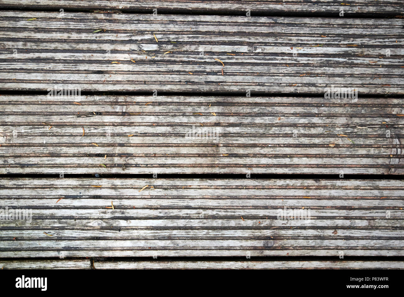 worn weathered wooden decking planks england uk Stock Photo