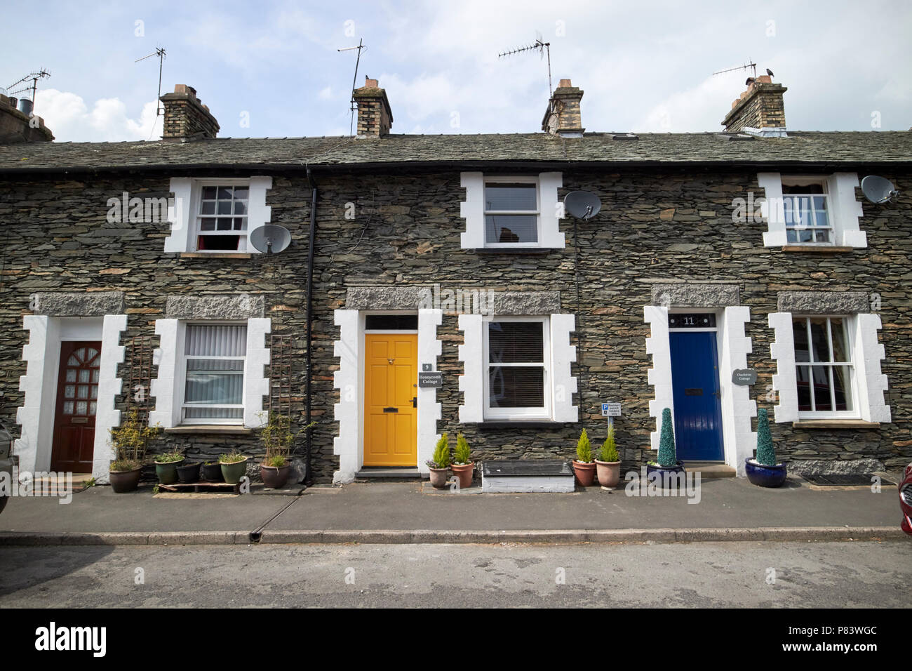 traditional lakeland stone style cottages now used as b+b holiday cottages windermere lake district cumbria england uk Stock Photo