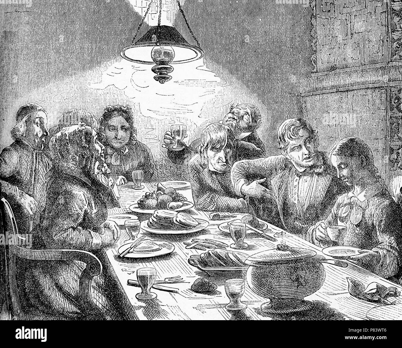 Vintage caricatures,  evening meal, family and friends around the table for dinner, plenty of food and wine Stock Photo