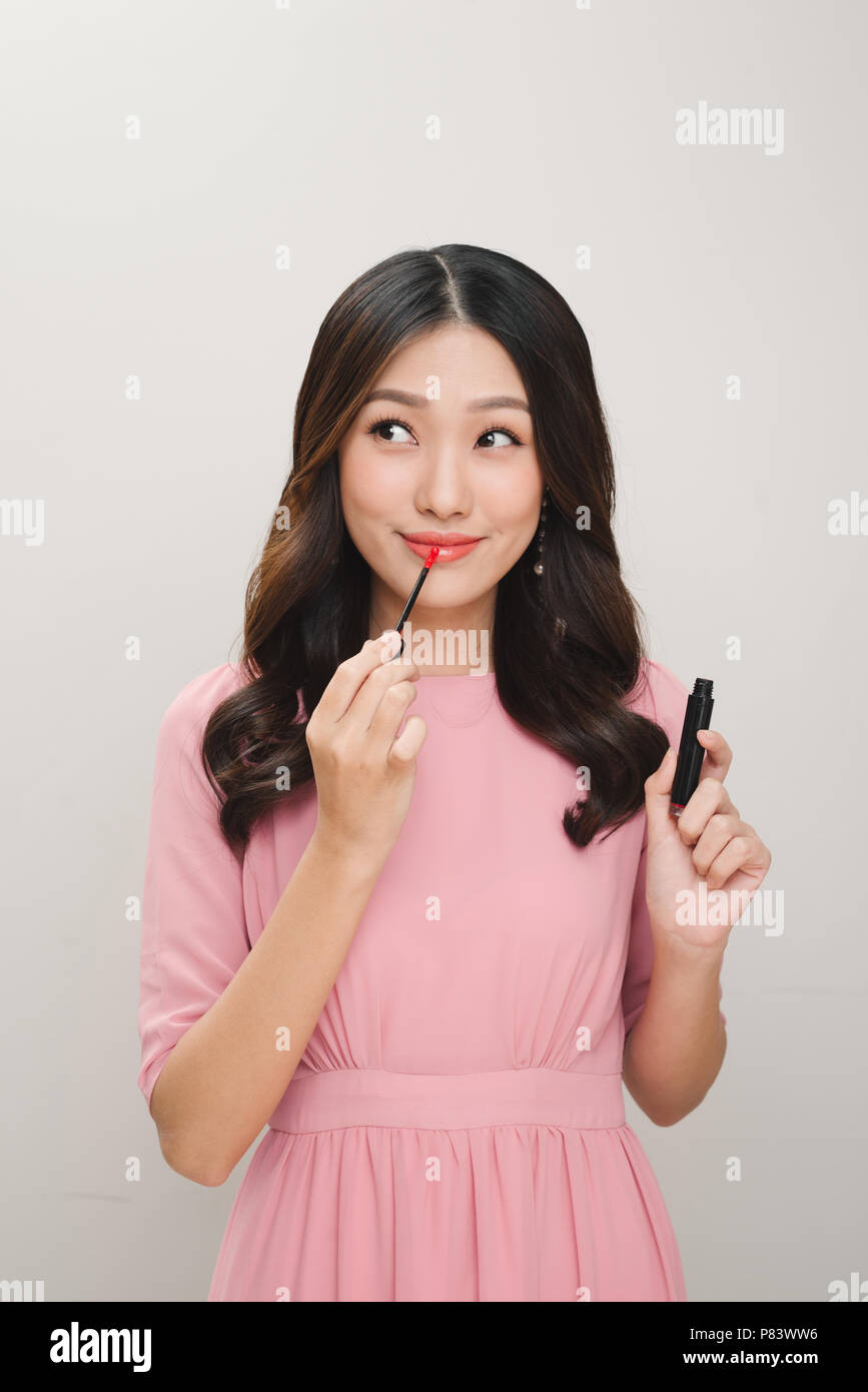 Girl applying lip gloss hires stock photography and images Alamy