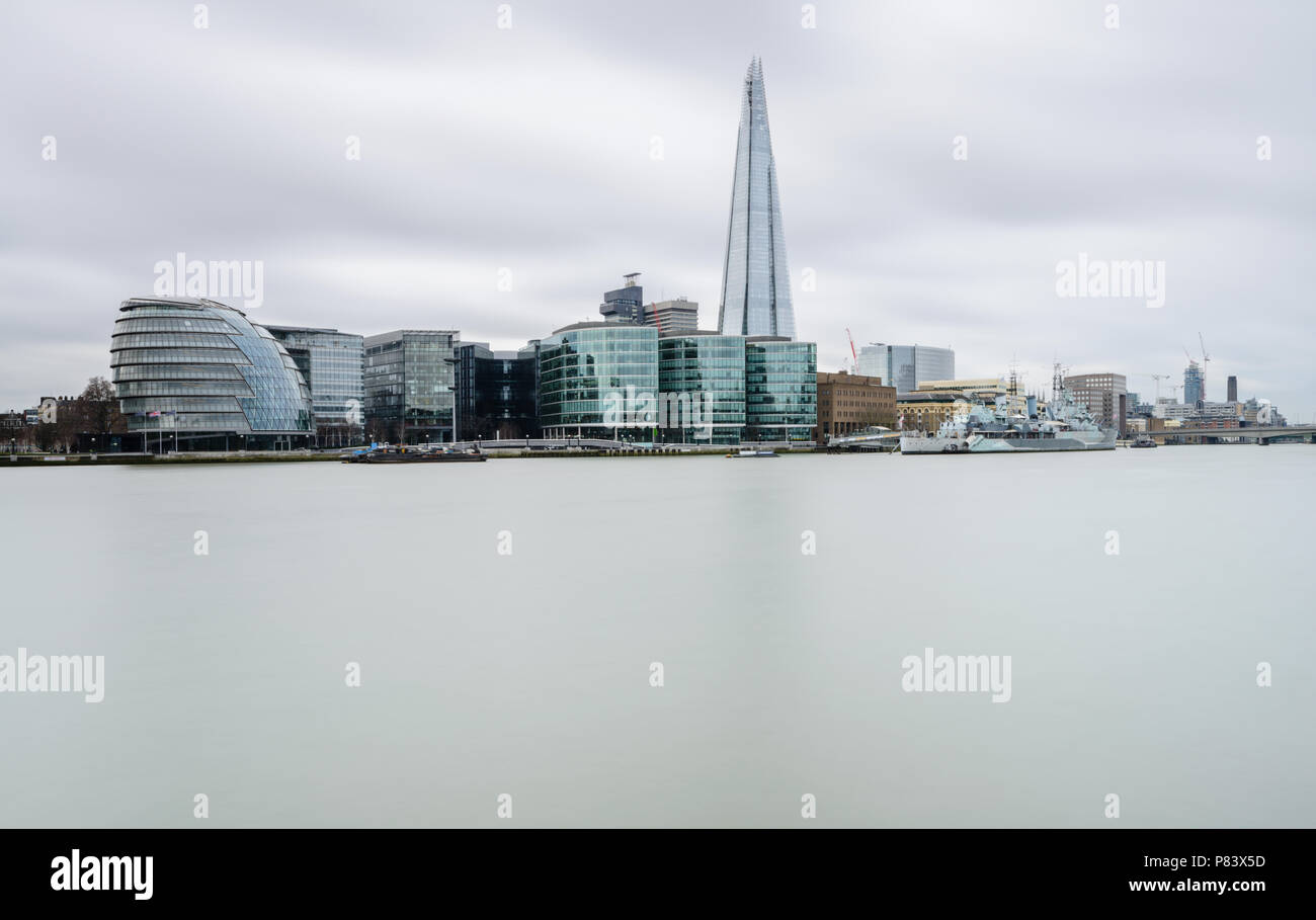 Long exposure of the view from the Tower of London across the River Thames to The Shard, City Hall, HMS Belfast, Tate Modern and London Bridge Stock Photo
