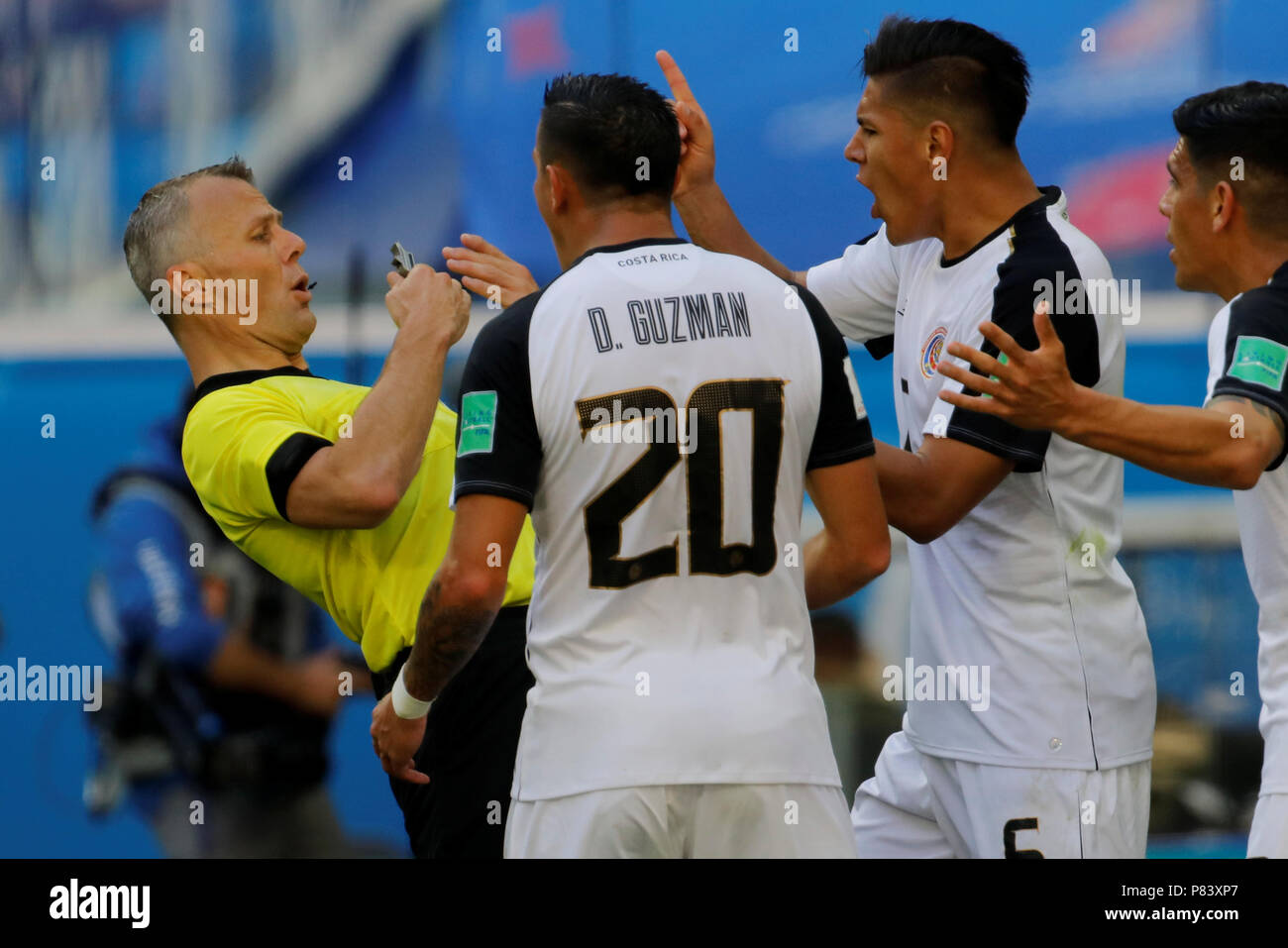 SAINT PETERSBURG, RUSSIA - JUNE 22: David Guzman (N20), Johnny Acosta (R) and Oscar Duarte of Costa Rica national team argue with referee Bjorn Kuipers (L) during the 2018 FIFA World Cup Russia group E match between Brazil and Costa Rica at Saint Petersburg Stadium on June 22, 2018 in Saint Petersburg, Russia. Stock Photo