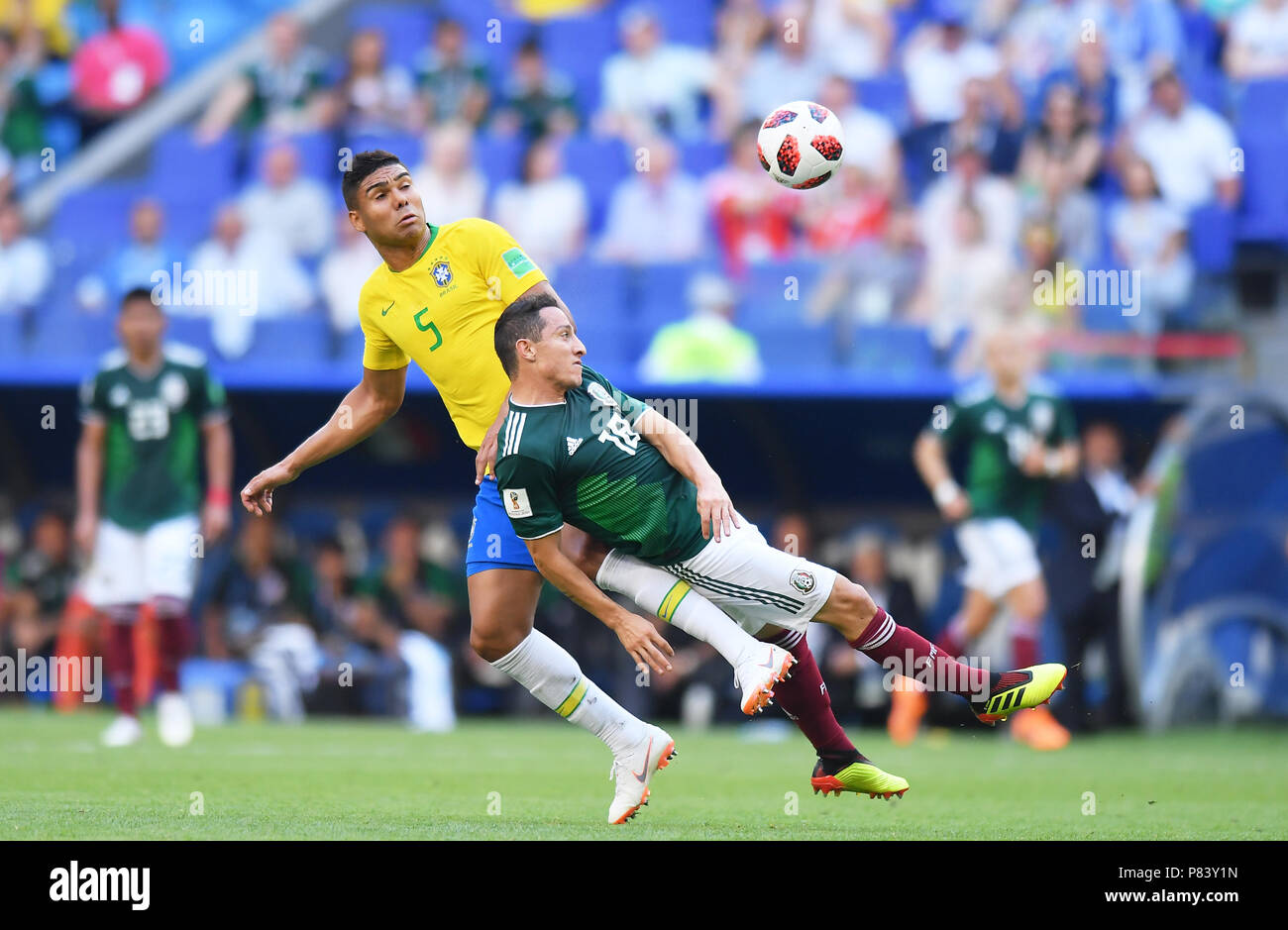 SAMARA, RUSSIA - JULY 02: Casemiro of Brazil competes with Andres Guardado of Mexico during the 2018 FIFA World Cup Russia Round of 16 match between Brazil and Mexico at Samara Arena on July 2, 2018 in Samara, Russia. (Photo by Lukasz Laskowski/PressFocus/MB Media) Stock Photo