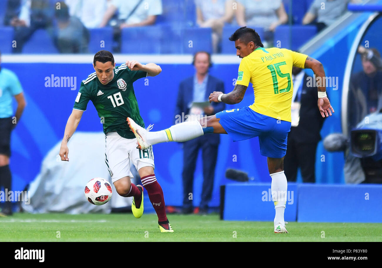 SAMARA, RUSSIA - JULY 02: Andres Guardado of Mexico competes with Paulinho of Brazil during the 2018 FIFA World Cup Russia Round of 16 match between Brazil and Mexico at Samara Arena on July 2, 2018 in Samara, Russia. (Photo by Lukasz Laskowski/PressFocus/MB Media) Stock Photo